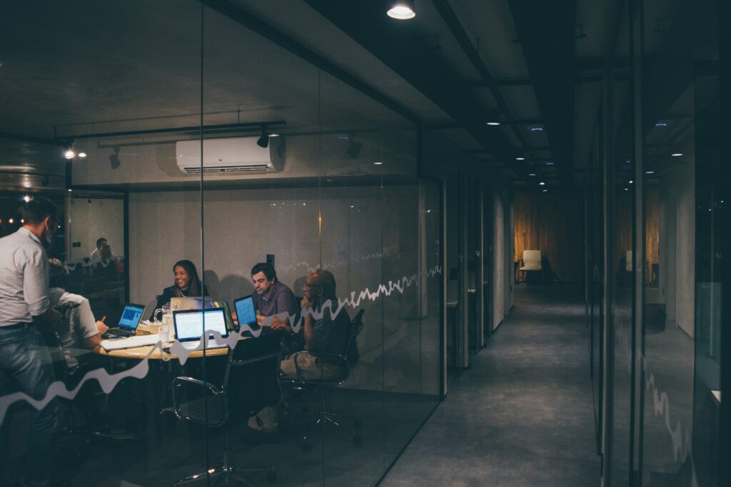 Decorative image of a team collaborating in a workspace